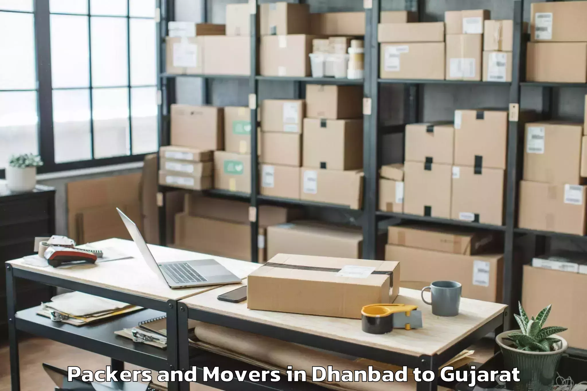 Reliable Dhanbad to Waghai Packers And Movers